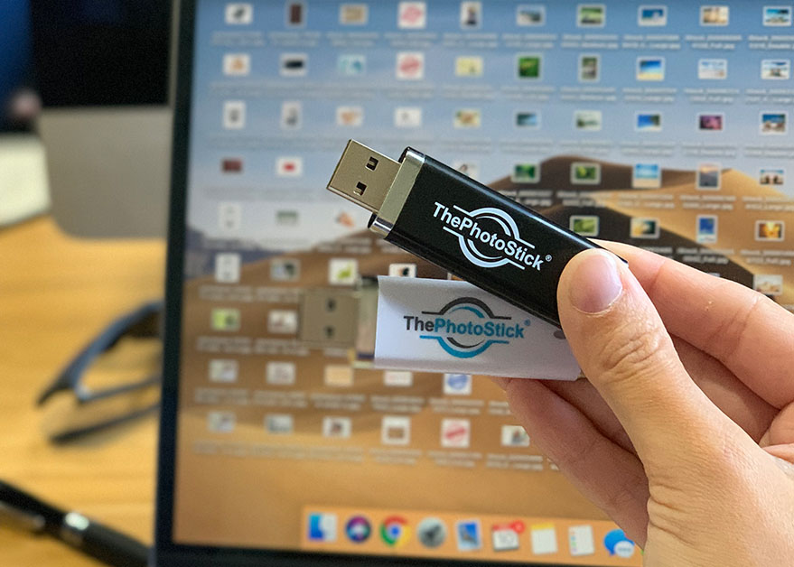 photo stick in hand with computer